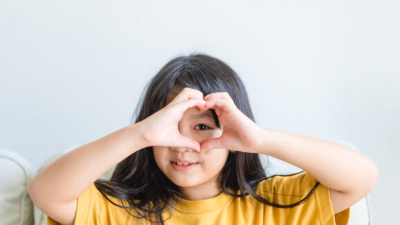 Healthy,Eyes,And,Vision.portrait,Happy,Asian,Kid,Child,Holding,Heart