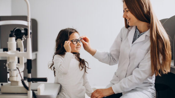 Little,Girl,Checking,Up,Her,Sight,At,Ophthalmology,Center