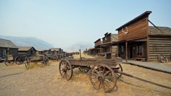 buildings and wagons in historic cowboy ghost town, Wyoming