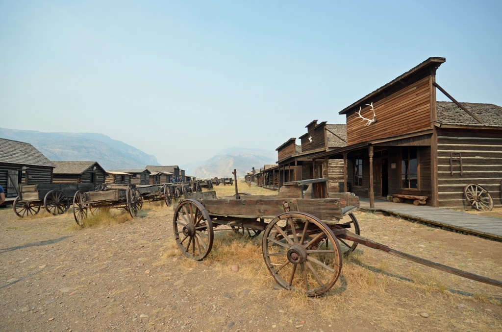 buildings and wagons in historic cowboy ghost town, Wyoming