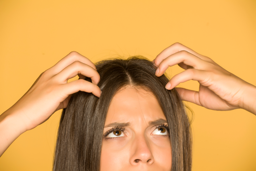 Beautiful,Young,Woman,With,Itchy,Scalp,On,Yellow,Background