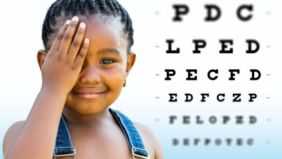 Close,Up,Face,Shot,Of,Little,African,Girl,Testing,Vision.