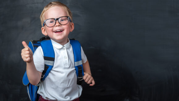 Happy,Smiling,Boy,In,Glasses,With,Thumb,Up,Is,Going