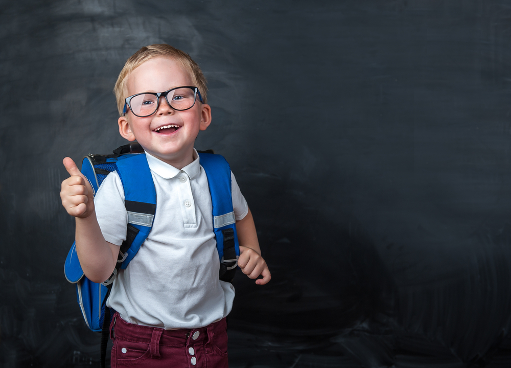 Happy,Smiling,Boy,In,Glasses,With,Thumb,Up,Is,Going